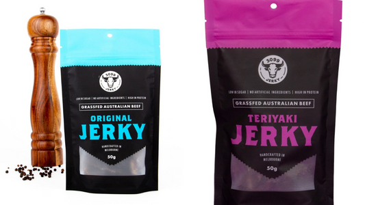 3099 Jerky packs of Original with pepper grinder beside and Teriyaki on the right, highlighting classic savoury versus sweet flavour.
